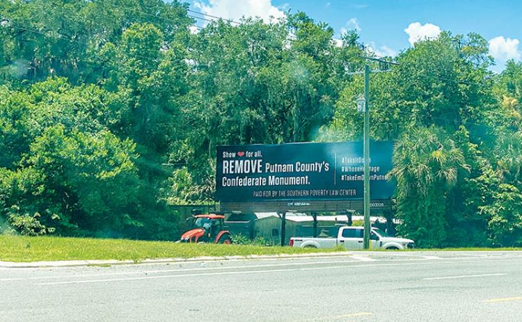 A billboard near the junction of U.S. 17 and State Road 100 in San Mateo is calling for the removal of the Confederate monument that currently sits on the lawn of the Putnam County Courthouse in Palatka.