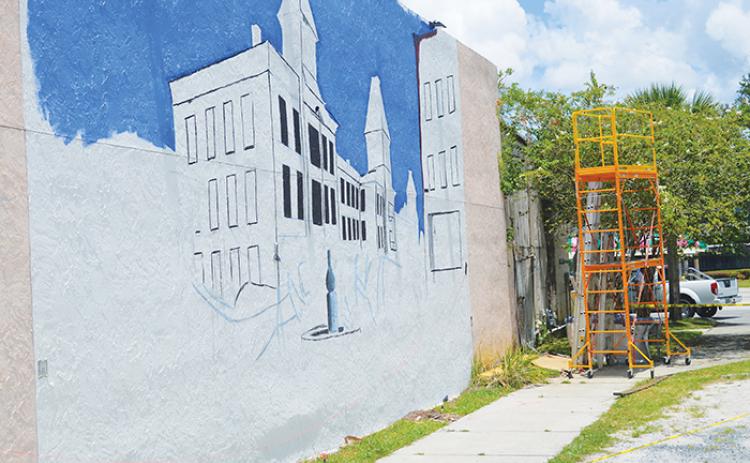 Work has begun on a mural that will depict the Putnam House Hotel that was built in 1885 and was torn down in 1922.
