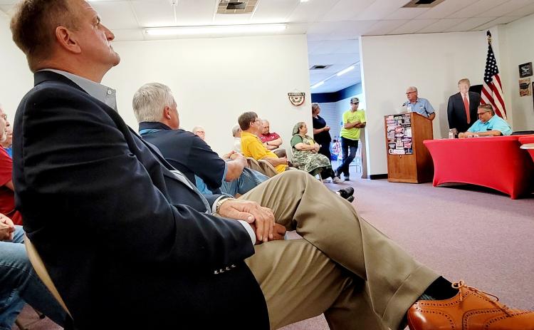Incumbent Larry Harvey, who is running against Tom Williams in the Republican primary for the Board of County Commissioners District 4 race, listens as Williams, the Republican Executive Committee chair, speaks about his views on endorsing candidates at a REC meeting earlier this month. (Palatka Daily News file)