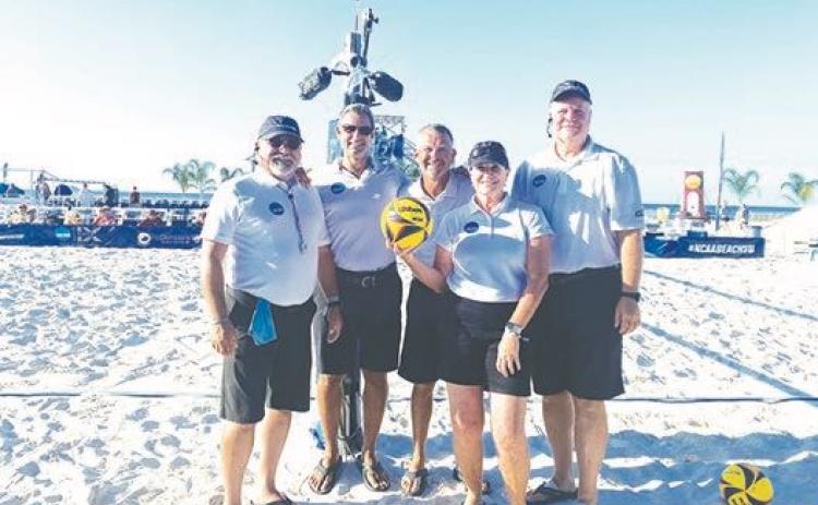 Rick Breed (center) poses with other officials during a break at the NCAA Beach Volleyball championships at Gulf Shores, Alabama, in May. (Submitted Photo)