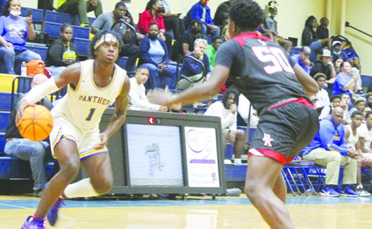 Palatka’s Jahmar Brown (left) looks to make a move against Jacksonville Bishop Kenny’s O.J. Eziemefe during a game last December at home. (MARK BLUMENTHAL / Palatka Daily News)