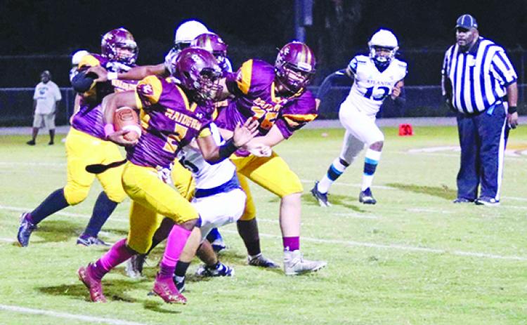 Crescent City's Eric Jenkins Jr. looks for running room with blockers in front of him Friday night against Port Orange Atlantic. (RITA FULLERTON / Special to the Daily News)