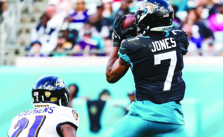 Jacksonville’s Zay Jones makes a catch in front of Baltimore’s Brandon Stephens during Sunday’s game at T.I.A.A. Bank Field. (JOHN STUDWELL / Special to the Daily News)