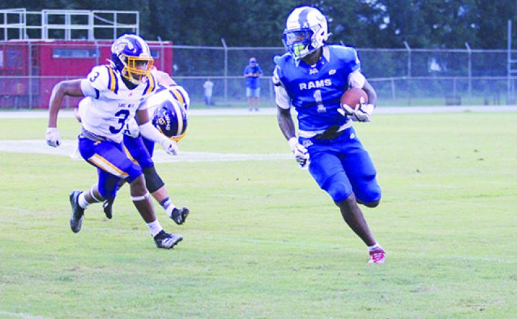 Reggie Allen rolls up the field for some rushing yards he had this year in the opening game of the season against Lake Weir. (MARK BLUMENTHAL / Palatka Daily News)
