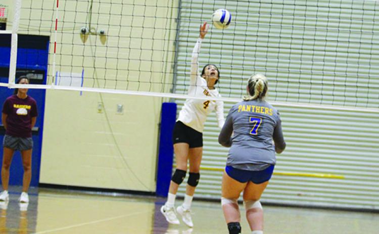 Crescent City’s Aleni Carbajal (left), the Daily News Player of the Year, attempts to hit the ball back over the net during the Putnam County Tournament match with Palatka on Sept. 3. (MARK BLUMENTHAL / Palatka Daily News) 