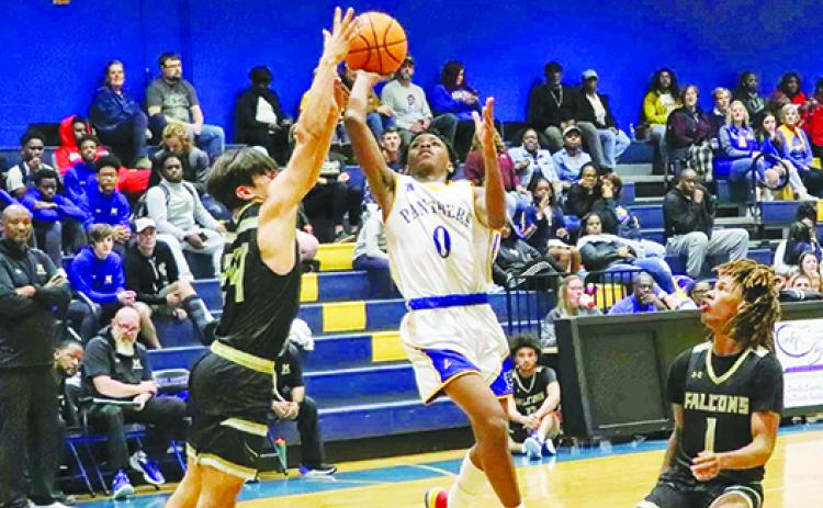 Palatka’s Tommy Offord puts a shot up against Menendez’s Julian Quintero during Friday’s game at the Panther Palace. (RITA FULLERTON / Special to the Daily News)