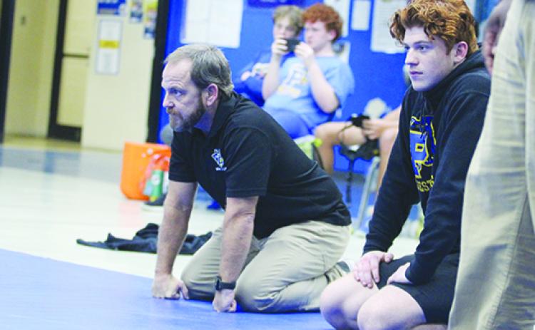 Palatka Junior-Senior High School wrestling coach Josh White (left) watched his team go 1-2 at the District 4-1A duel tournament. (MARK BLUMENTHAL / Palatka Daily News)