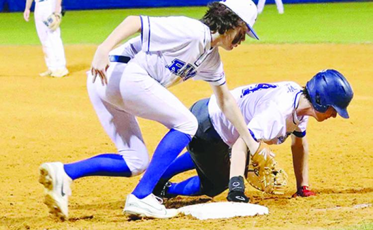 Peniel Baptist Academy’s Nick Fisher gets back into first base on a pickoff attempt as Interlachen’s Buck Taylor applies the tag. (RITA FULLERTON / Special to the Daily News)