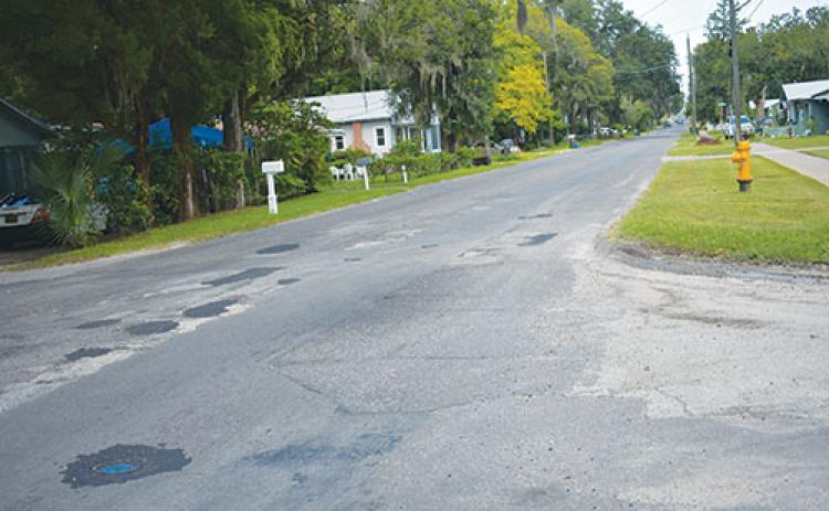 BRANDON D. OLIVER/Palatka Daily News – St. Johns Avenue at the intersection of Bates Avenue can be seen with numerous potholes that have been patched.