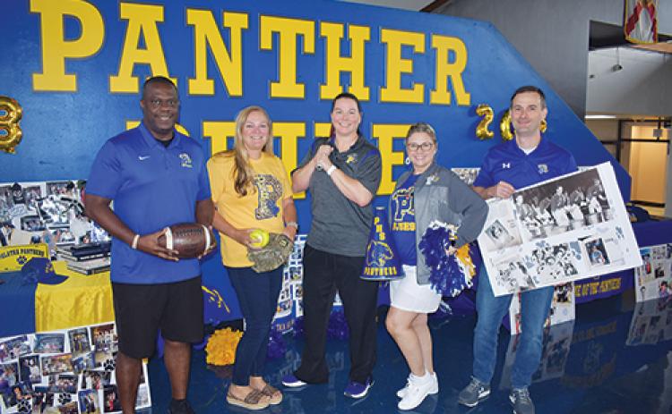 BRANDON D. OLIVER/Palatka Daily News -- Palatka Junior-Senior High School Principal Cathy Oyster, center, stands with her assistant principals, from left, Lamar Purifoy, Joy Eubanks, Cindy Bellamy and Michael Chaires on Friday as they show their Panther spirit before school begins Aug. 10.