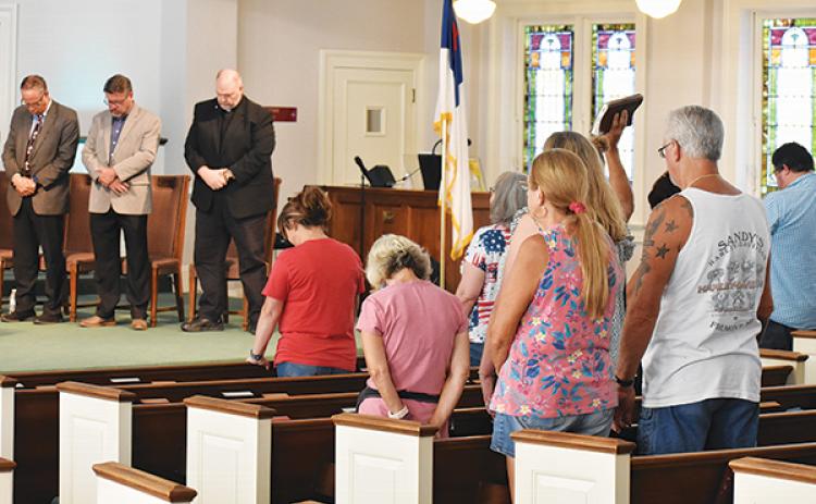BRANDON D. OLIVER/Palatka Daily News – Faith leaders and local residents pray during the Cry Out America Patriot's Day prayer service Monday in Palatka.