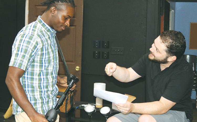 TRISHA MURPHY/Palatka Daily News – Florida School of the Arts student Lmontiaz Slocumb, left, is pictured with the new assistant professor of acting, Ryan Mahannah, in the black box theater at the school.