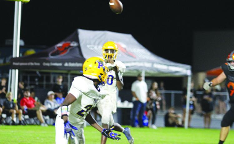 Palatka quarterback Tommy Offord swings a pass out to receiver K.J. Wright during the first half of Friday night’s game at Tocoi Creek. (MARK BLUMENTHAL / Palatka Daily News)