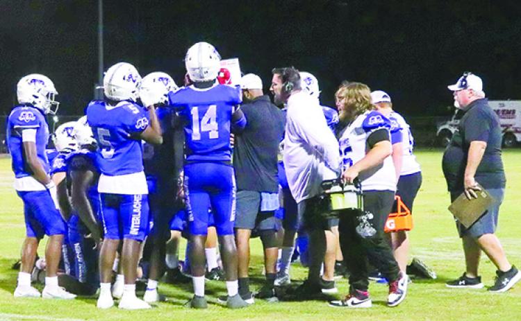 Interlachen Junior-Senior High football players huddle during a timeout in the game against Crescent City on Sept. 8. (RITA FULLERTON / Special to the Daily News)