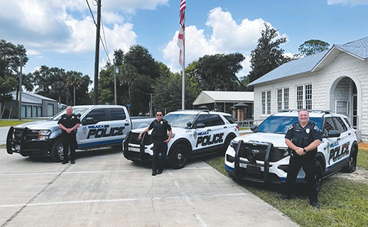 Photo courtesy of the town of Welaka – From left, Welaka Police Department Chief Michael Porath, Officer Tommy Owens and Officer Todd Bryant stand by their vehicles outside Town Hall.