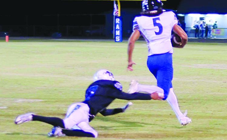 Mount Dora Christian’s Taylor Cline is on his way to a touchdown as Interlachen’s Sabian McClendon is short on the tackle attempt during the Bulldogs’ 50-7 victory over the Rams Friday night. (RITA FULLERTON / Special to the Daily News)