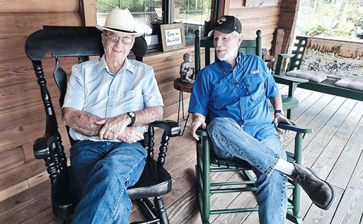 Submitted photo – Sam Wimberly, left, and Chuck Hardwicke sit on the porch at the Bartram Inn in Palatka. The two will be the featured performers from 7-9 p.m. Friday at the Larimer Arts Center in Palatka.