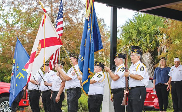 File photo – Veterans from American Legion Bert Hodge Post 45 and VFW Post 3349 hold flags during the 2021 Veterans Day ceremony at the Palatka riverfront.