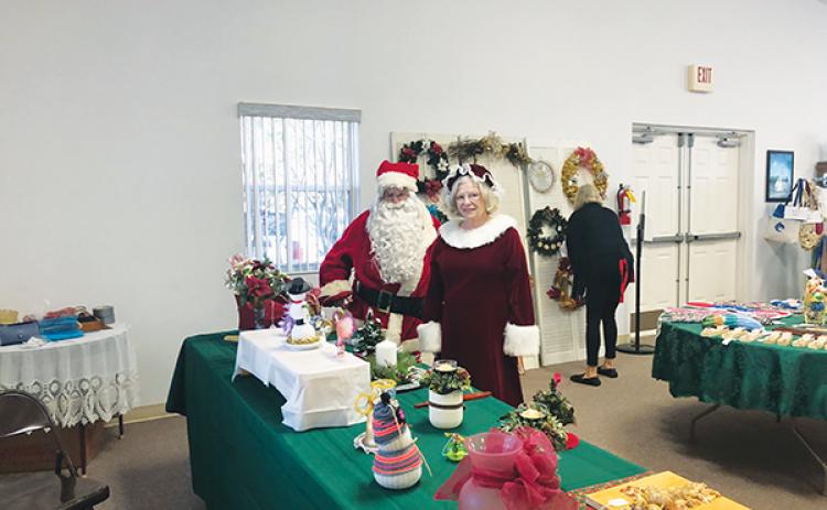 Photo submitted by Kitty Miller – Santa and Mrs. Claus participate in a previous Silver Tea & Christmas Bazaar, which will occur this weekend in Crescent City.