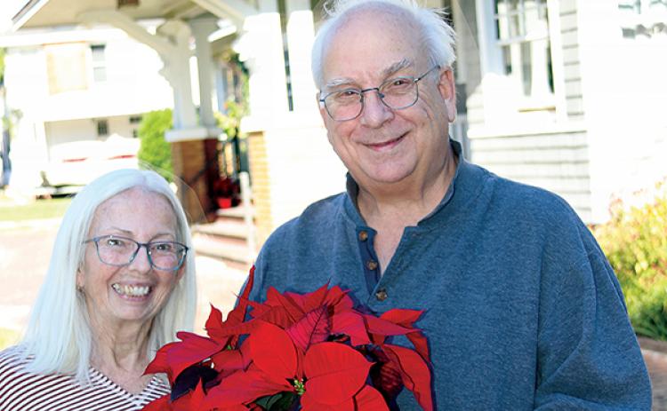 TRISHA MURPHY/Palatka Daily News – Beverly Genader, left, and her husband, Bob Morgan, stand in front of their historic home, which will be part of Saturday’s 2023 Christmas Tour of Homes in Palatka.