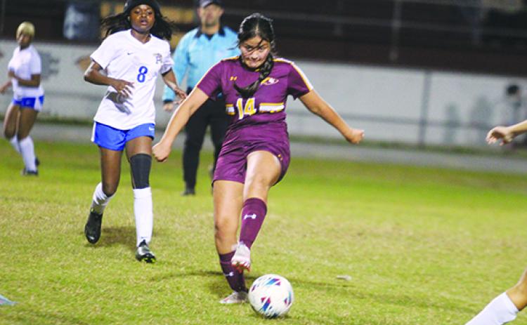 Crescent City’s Griselda Vargas looks to control the ball as Palatka’s Ymira Passmore pursues her during Thursday night’s match at Crescent City, won by the host Raiders, 2-0. (MARK BLUMENTHAL / Palatka Daily News)