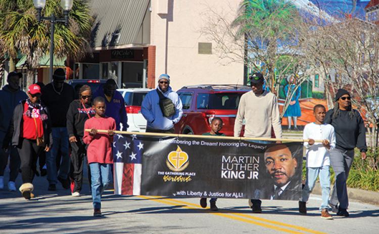 File photo – Putnam County residents participate in the 2023 Martin Luther King Jr. Legacy Walk in Palatka.