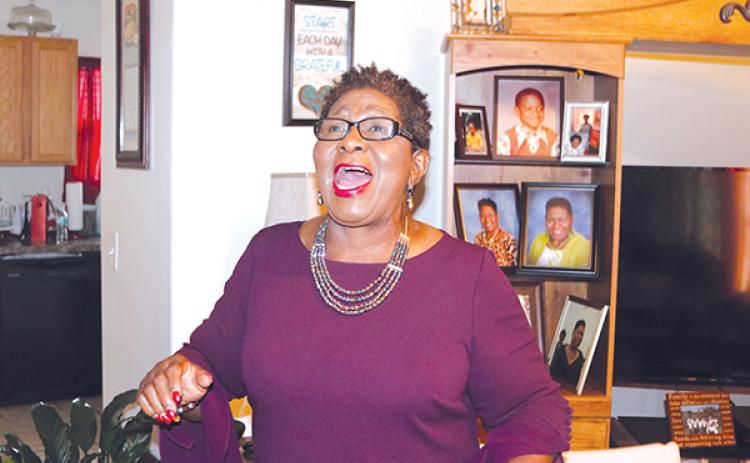 TRISHA MURPHY/Palatka Daily News – Ruth Simpson-Milton, pictured singing praises to the Lord in her Palatka home, is being recognized as an “Inspiring Adult” on Saturday during the annual Martin Luther King Jr. Commemoration Breakfast.