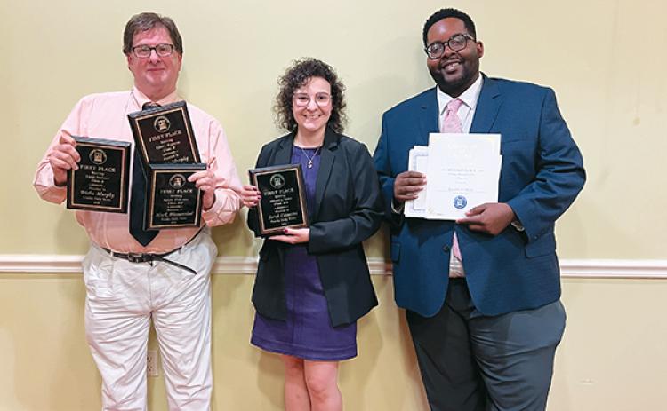 LISA CAVACINI/Special to the Daily News – From left, Daily News Sports Editor Mark Blumenthal, news reporter Sarah Cavacini and Editor Brandon D. Oliver hold the Florida Press Club awards the newspaper received Saturday.