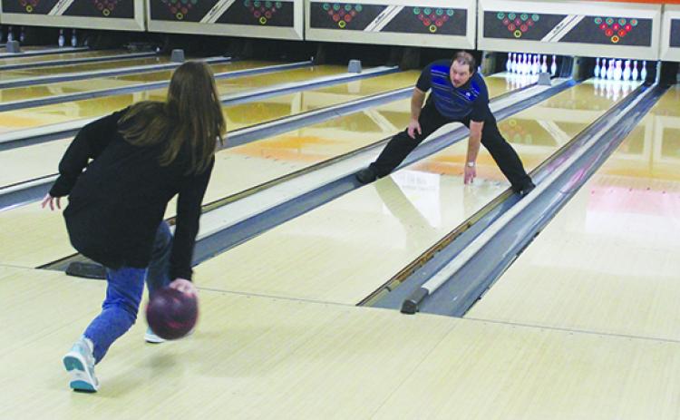 Palatka Junior-Senior High School bowling coach Kelly Lake (right) goes through a drill with junior Ashley Griffis during a practice in late October at Putnam Lanes. (MARK BLUMENTHAL / Palatka Daily News)