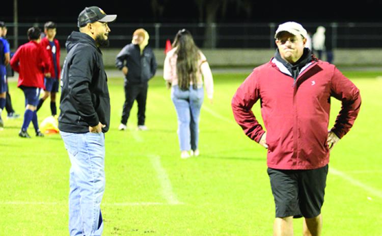 Crescent City Junior-Senior boys soccer coach Jeff Lease (right) and assistant Tony Carbajal react after the Raiders ended in a 1-1 tie Thursday night with host Pierson Taylor. (MARK BLUMENTHAL / Palatka Daily News)