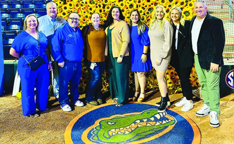 Putnam County softball coaches and Florida Gators softball personnel pose for a picture after their Feb. 3 meet-and-greet event in Gainesville. From left are Interlachen head coach Tonya Troiano, Peniel head coach Jeff Hutchins, Palatka assistant coach Corey Booth, Crescent City assistant coach Aubrey Brown, Palatka assistant coach Mindi Buckles, UF pitching coach Chelsey Dobbins, Palatka head coach Katelynn Smith, UF player Reagan Walsh and UF head coach Tim Walton. (Submitted / Mindi Buckles)