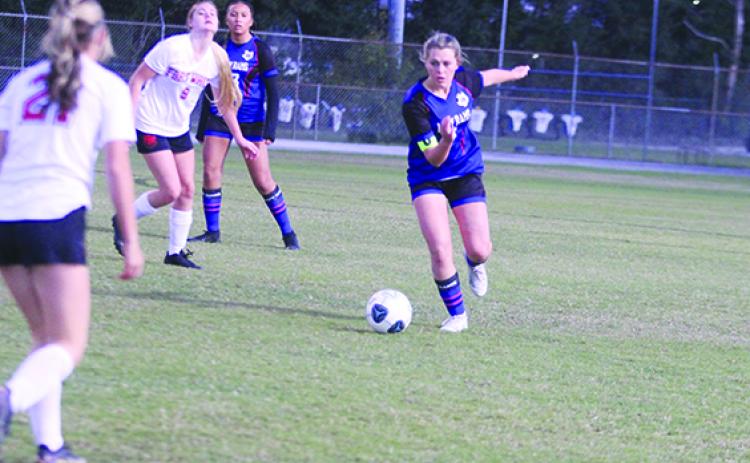 Interlachen’s Madisyn Guessford moves the ball up the field during a November game against Fort White. (MARK BLUMENTHAL / Palatka Daily News)