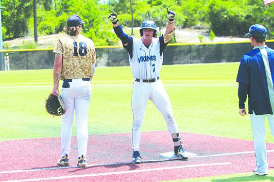 St. Johns River State College’s Tripp Dais acknowledges his teammates after delivering a two-run single in the seventh inning of the Vikings’ 11-8 Region 8 championship win over South Florida State. (MARK BLUMENTHAL / Palatka Daily News)