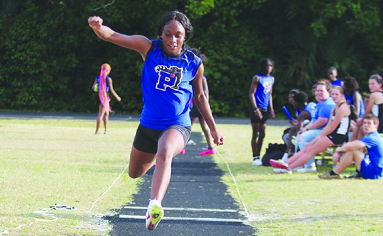 Palatka’s Destiny Williams, here competing in the triple jump at the Putnam County Championship at home on March 26, will compete in both the triple jump and high jump at the FHSAA 2A championship today. (MARK BLUMENTHAL / Palatka Daily News)