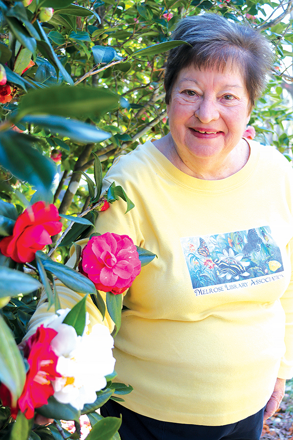 TRISHA MURPHY/Palatka Daily News – Virginia Walkup, president of the Melrose Library Association, shows some of the camellia bushes at her friend, Kathi Warren’s, home in Melrose.