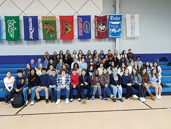 Photo submitted by Doug Thompson – Some of the 70 Q.I. Roberts Junior-Senior High School students who were inducted into Interact on Thursday sit on the gym bleachers before the ceremony.