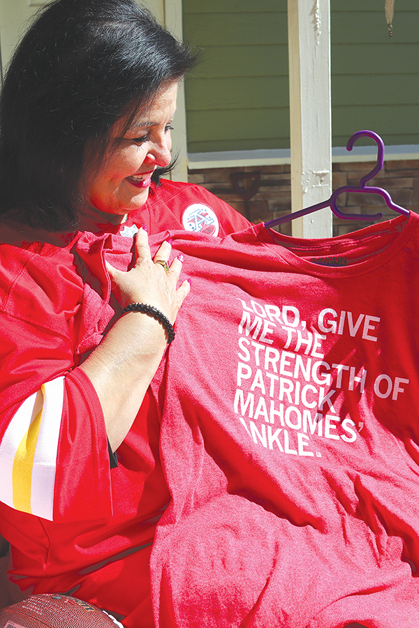 TRISHA MURPHY/Palatka Daily News – Mimi Alvarez shows her favorite Kansas City Chiefs T-shirt, which she wears all the time.