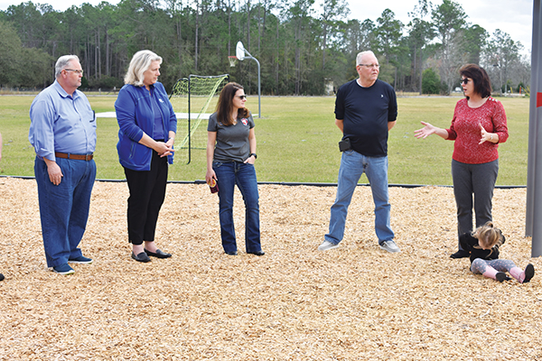 BRANDON D. OLIVER/Palatka Daily News – County Commissioner Leota Wilkinson, right, talks to county, Florida Power & Light, and Bardin officials Friday before the ribbon-cutting ceremony for Etoniah Community Park in Bardin.
