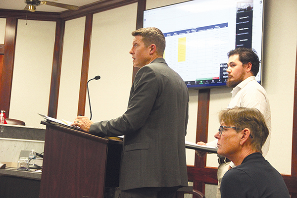 SARAH CAVACINI/Palatka Daily News – Assistant City Manager Jonathan Griffith, left, and Public Works Director Del McMillen, back right, tell the Palatka City Commission on Thursday about the plans to repair parts of the Jenkins Community Center.