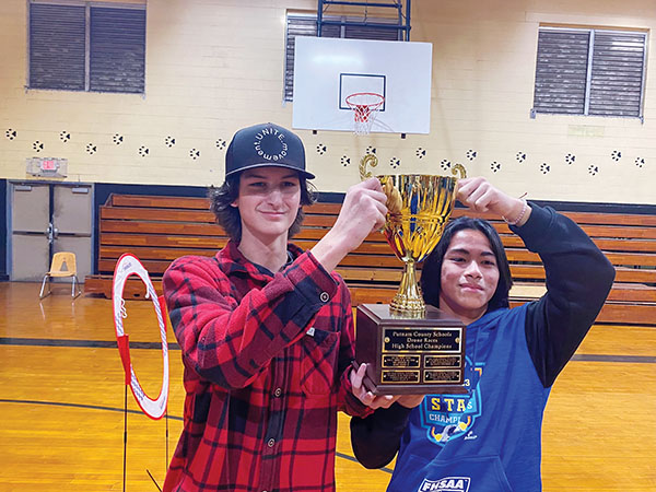 Palatka Junior-Senior High School Drone team members Mason Blevins and Evan Williamson hoist a trophy after winning a tournament in the club’s inaugural year.