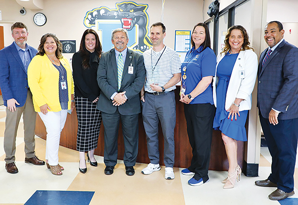 Photos courtesy of the Putnam County School District – Palatka Junior-Senior High School Assistant Principal Michael Chaires, center, stands with local and state officials after being named the state's Assistant Principal of the Year.