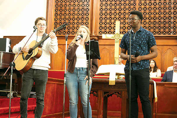 TRISHA MURPHY/Palatka Daily News – During the National Day of Prayer on Thursday in Palatka, UNITE singers, from left, James and Summer Cox and Brandall Kearse, led the more than 50 participants in singing  the national anthem.