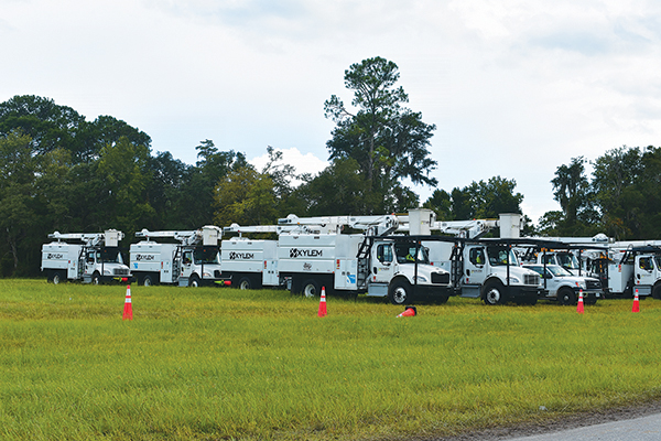 BRANDON D. OLIVER/Palatka Daily News – Dozens of utilities trucks are stationed at the Putnam County Fairgrounds in East Palatka on Wednesday in preparation of damage from Idalia.