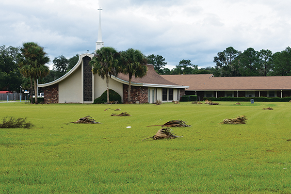 BRANDON D. OLIVER/Palatka Daily News – Palm fronds litter the ground outside Christ Independent Methodist Church in Palatka after Hurricane Idalia passed over Putnam County.