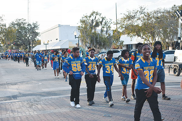 BRANDON D. OLIVER/Palatka Daily News –  Palatka Junior-Senior High School football players participate in the Homecoming Parade on Thursday.