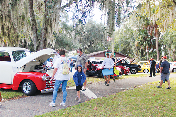 SARAH CAVACINI/Palatka Daily News – People stop to look at different vintage cars during the festival, which took place downtown.
