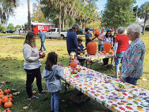 Submitted by Judi Costanzo – Children and their families decorate pumpkins Saturday during the festival in Interlachen.
