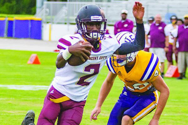 Crescent City quarterback Naykee Scott runs for a 2-yard touchdown in the first quarter of Friday’s preseason football game against Union County. (FRAN RUCHALSKI / Palatka Daily News)
