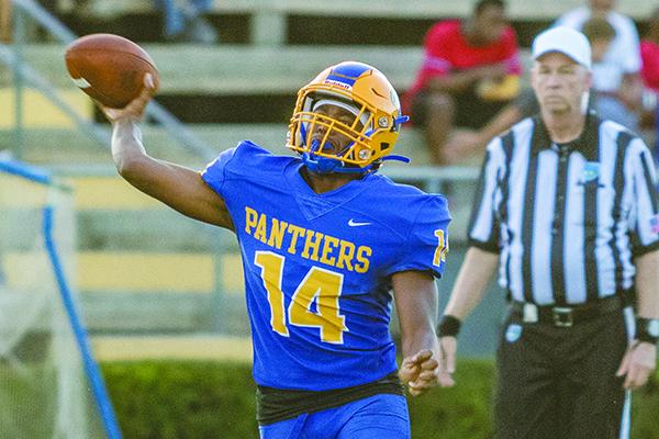 Palatka High quarterback Demontae Ashley, who passed for four touchdowns, tying his own school record, looks for a receiver against Menendez on Friday night. (FRAN RUCHALSKI / Palatka Daily News)