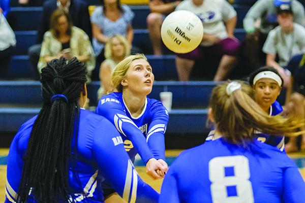 Interlachen High School's Kirby Mason (2) pops the ball back over the net in the first set of their match against Palatka.